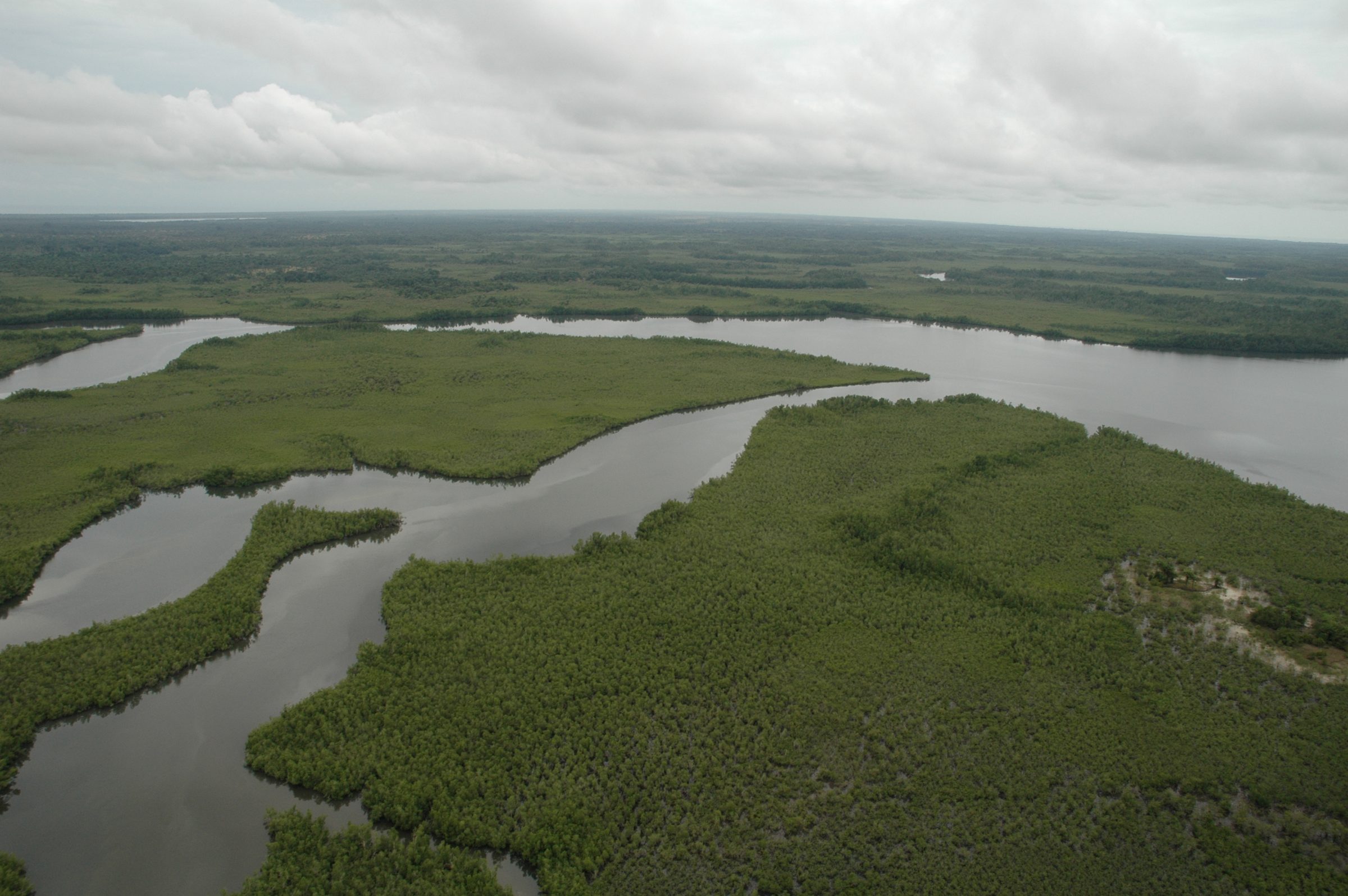 Remote tropical island seen from the water — editorial stand-in
